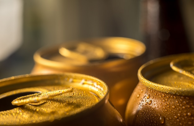 Yellow beer cans with water droplets