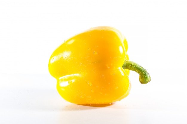 Yellow bell peppers on white 