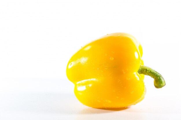 Yellow bell peppers on white 