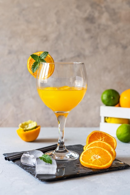 Yellow bird cocktail with rum orange and lime juice ice