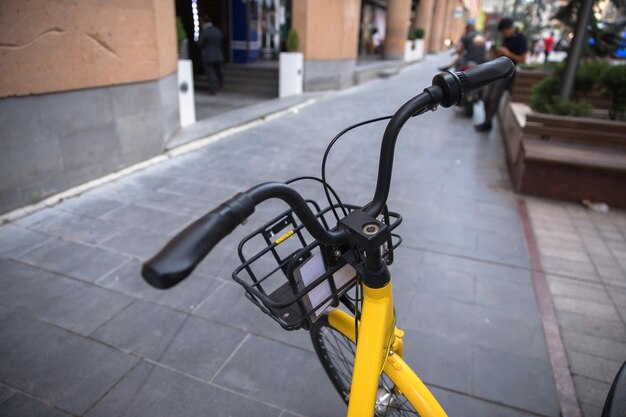 Yellow and black bicycle in the streetxA