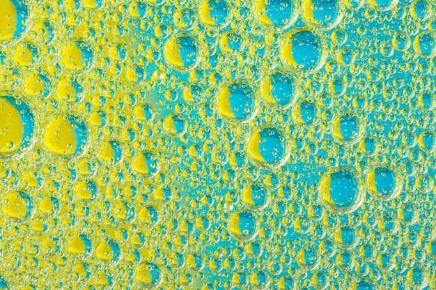 Yellow and blue macro bubblesBubbles on blue and yellow background  Macro