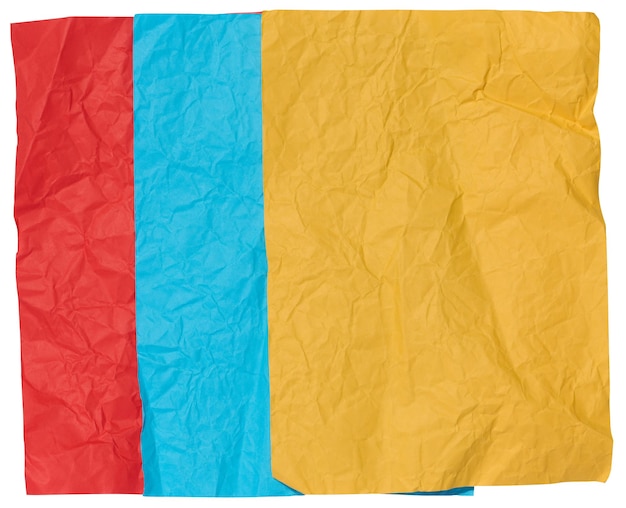 Yellow blue and red crumpled sheets of paper on a white background