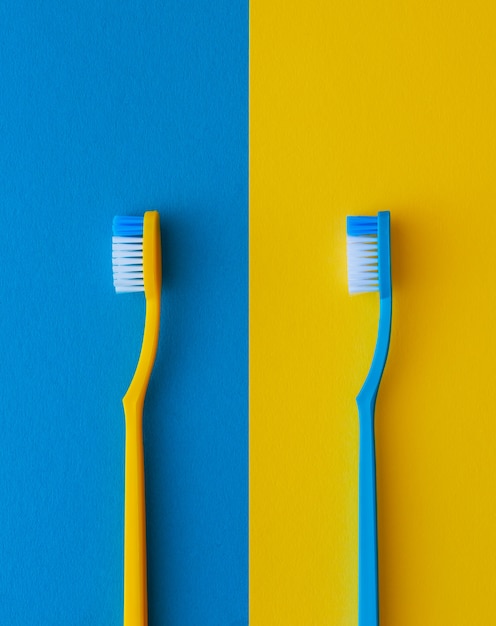 Yellow and blue toothbrushes