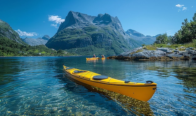 Photo a yellow boat with a red kayak in the water