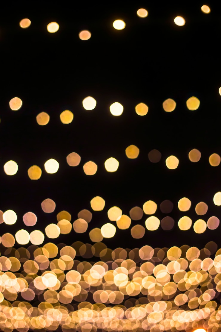 Photo 다른 주파수와 검은 배경에 노란색 bokeh.