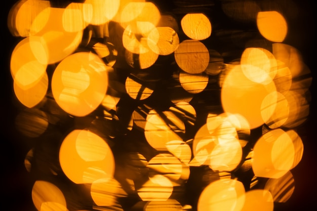 Yellow Bokeh of Light. Golden Bokeh of Light. Defocused light with black background. 