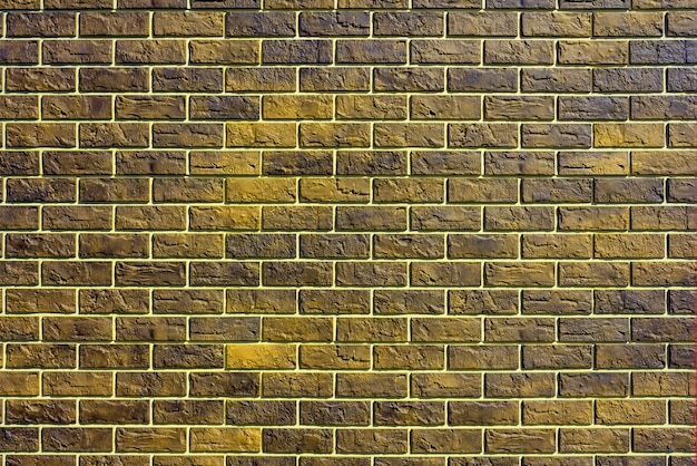 黄色いレンガの壁。現代の建設業。建物のファサード。