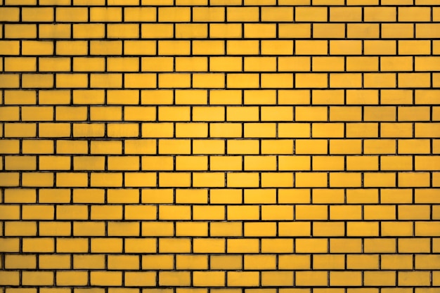 黄色のレンガの壁のパターンの背景