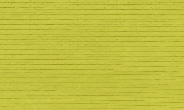 A yellow brick wall that is made of bright yellow bricks.