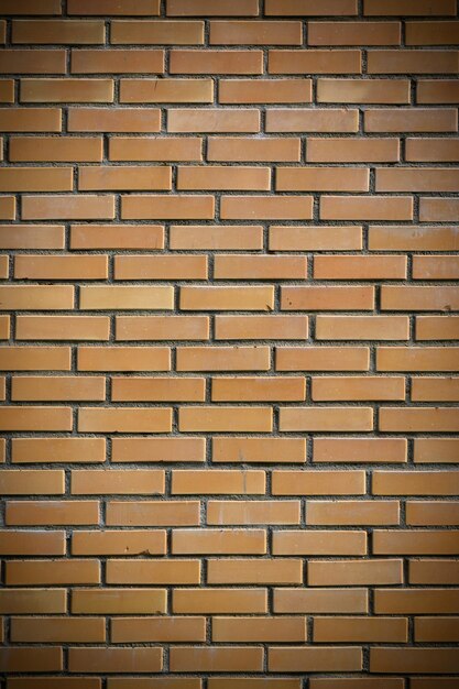 Photo yellow brick wall useful as a background