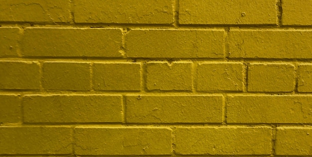 A yellow brick wall with the word " on it "