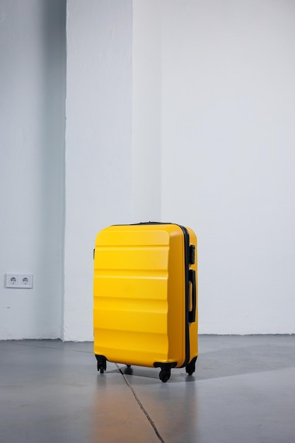 Yellow bright suitcase for tourist trips highquality yellow suitcase