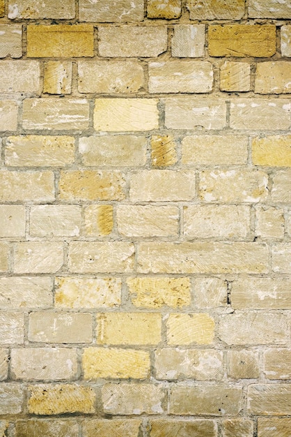 Yellow and brown brick wall background texture