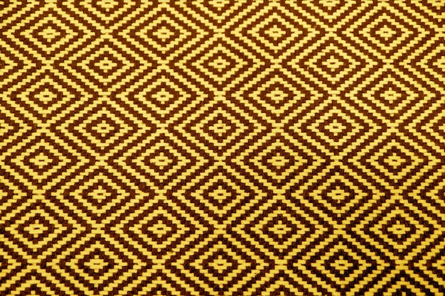 Yellow and Brown Geometric Pattern of Ethnic Fabric for Abstract Background