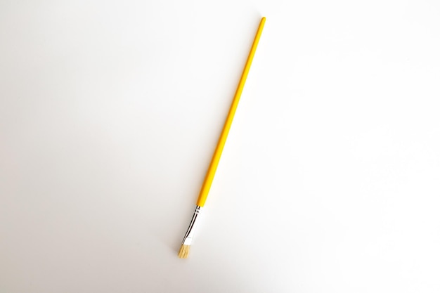 Yellow brush on a white background