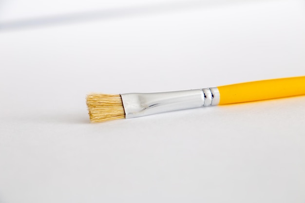 Yellow brush on a white background