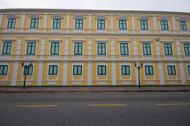 Yellow Building Wall Green window