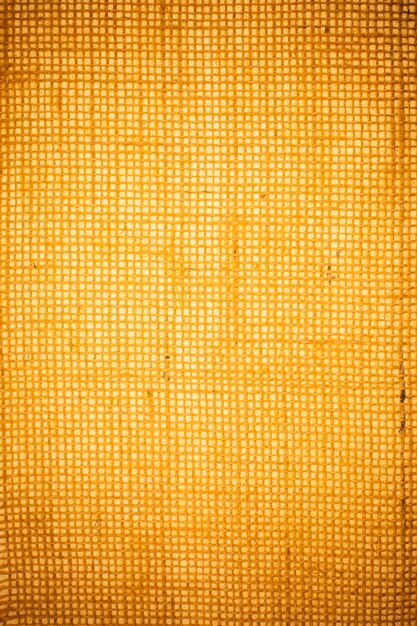 Yellow burlap fabric texture background.