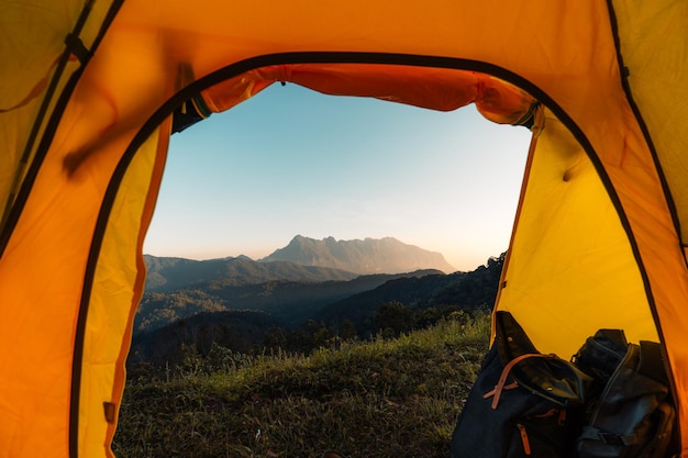 Yellow camping on the mountain, mountain view in the morning