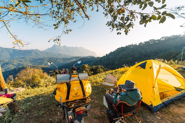 Yellow camping on the mountain, mountain view in the morning