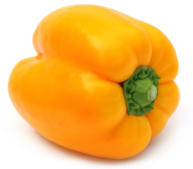 Yellow capsicum over white background