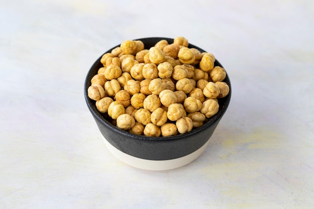 Yellow chickpeas on wooden background