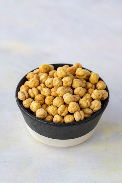 Yellow chickpeas on wooden background