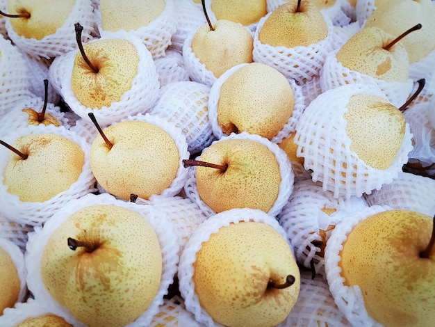 Yellow Chinese Pears in White Mesh Protective Foam with Selective Focus