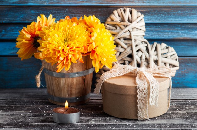 Yellow chrysanthemum in rustic interior