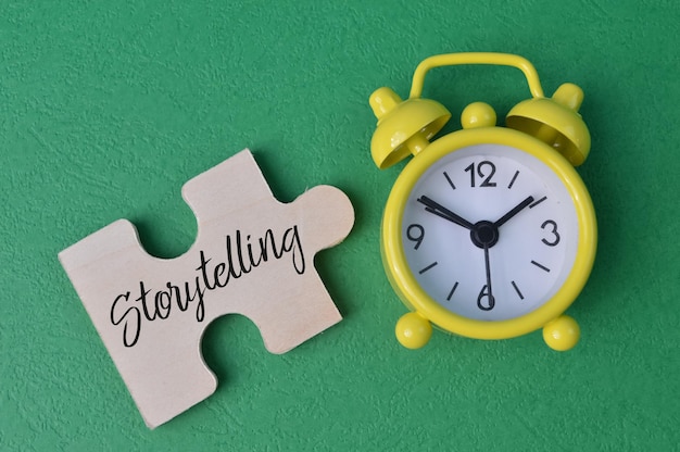 Yellow clock and jigsaw puzzle with text STORYTELLING