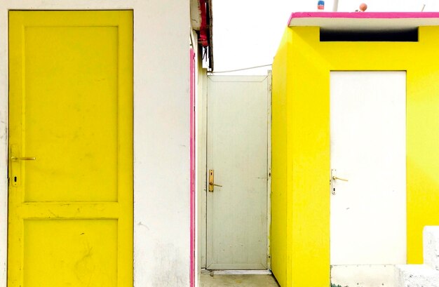 Yellow closed door of building