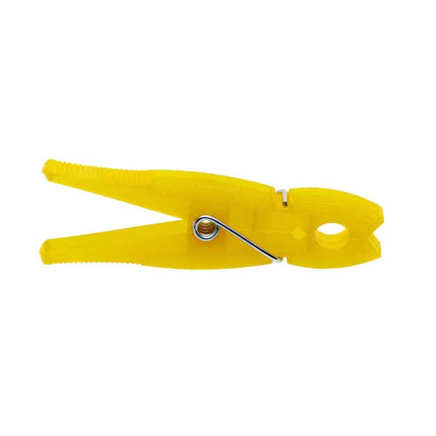 Yellow clothespin with a steel spring on a white background