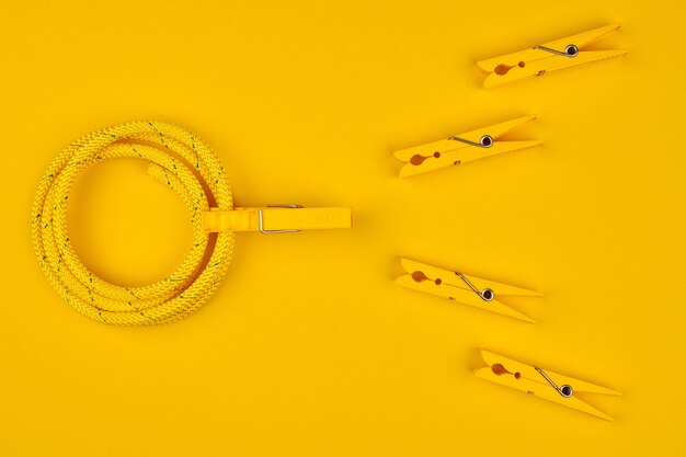 Yellow clothespins and rope