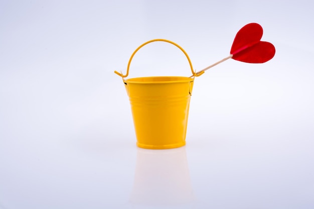 yellow color bucket and red heart shape
