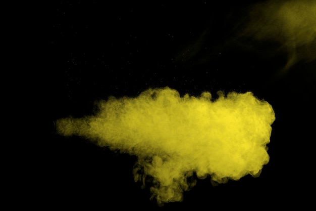 yellow color powder explosion cloud.