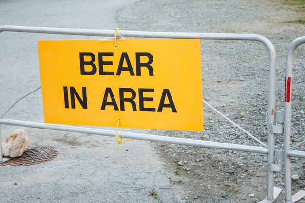 Yellow colored warning sign bear