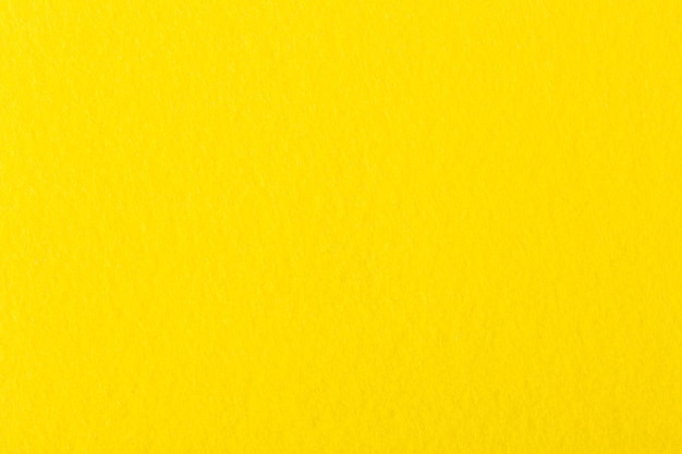 Photo yellow coloured felt background high resolution photo