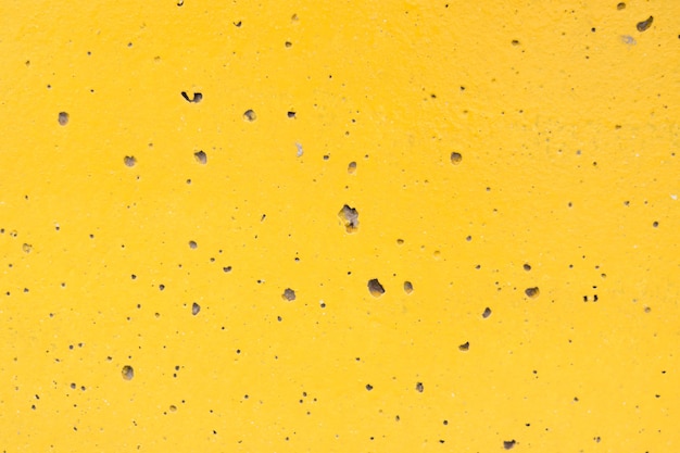 黄色のコンクリート壁テクスチャ背景