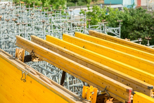 Yellow construction beams during the construction of a transport bridge