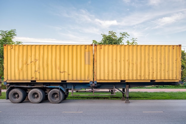 Yellow container box trailer parked