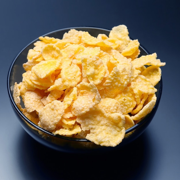 Yellow corn flakes in a bowl. flour food