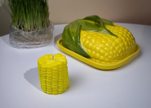 Yellow corn-shaped candle in the kitchen interior