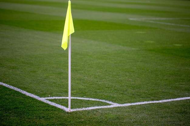 Yellow corner flag on a soccer field