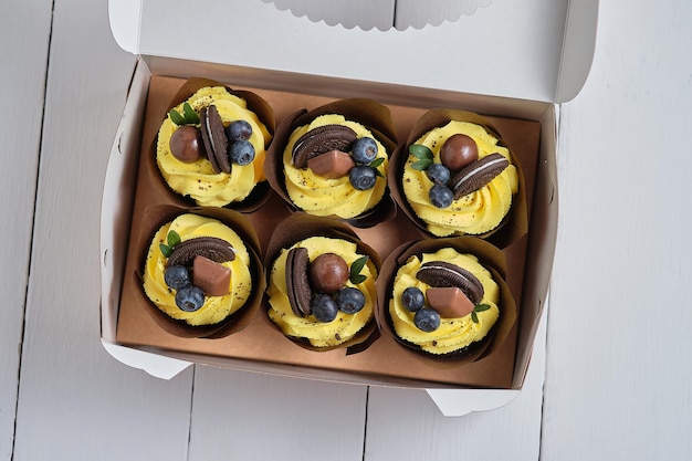 Yellow cupcakes with buttercream and berry filling Holiday confectionery