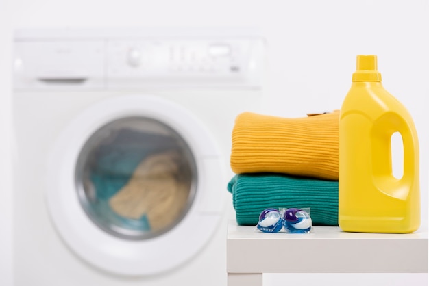 Yellow detergent bottle with washing tablets