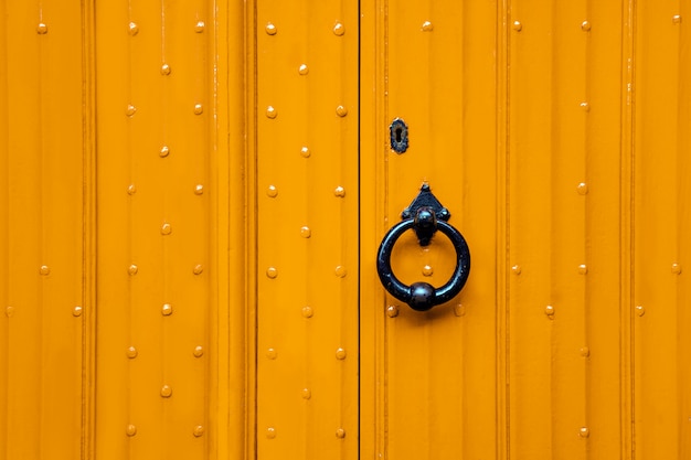 Yellow door and black handle