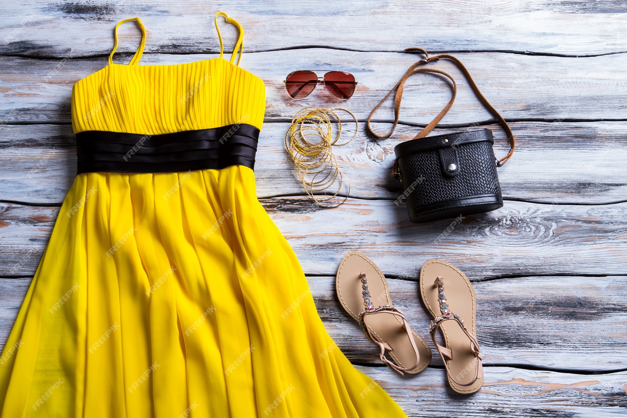 Premium Photo | Yellow dress and beige sandals. sandals, dress and black  purse. stylish dress with classic handbag. lady's outfit with dark  accessory.