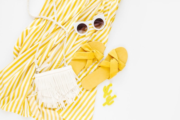 Yellow dress with stripes. Women's stylish summer outfit.