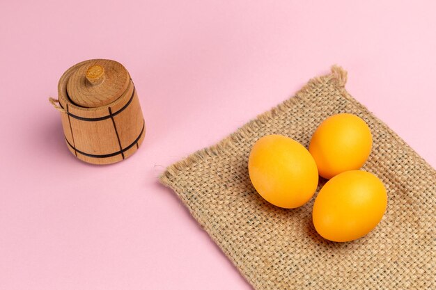 Yellow easter eggs on the sackcloth bag